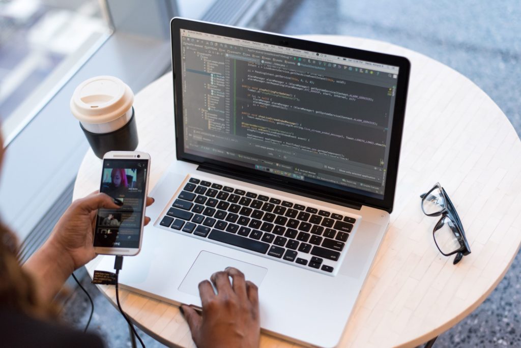 Basso Marketing Agency of Rochester offers general answers to common questions about its website development services for Michigan businesses as well as the many other marketing services it provides, as represented by this image of a laptop monitor depicting a developer's code.